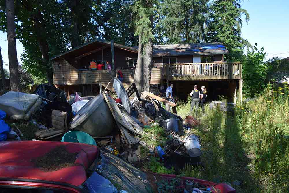 home overgrown trash nuisance property